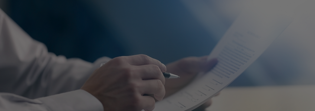 Male hands with pen and paper.png